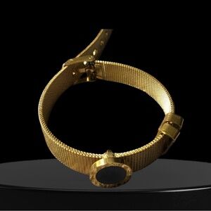 Gold mesh band Bradley with a round black face with numbers Vintage